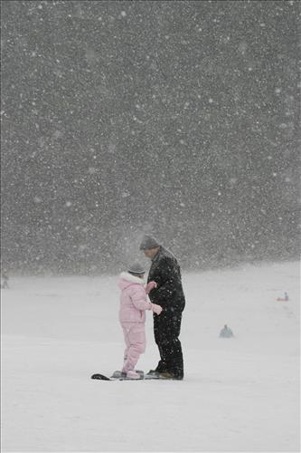 Sledding at Kendall Hills Adult and Child
