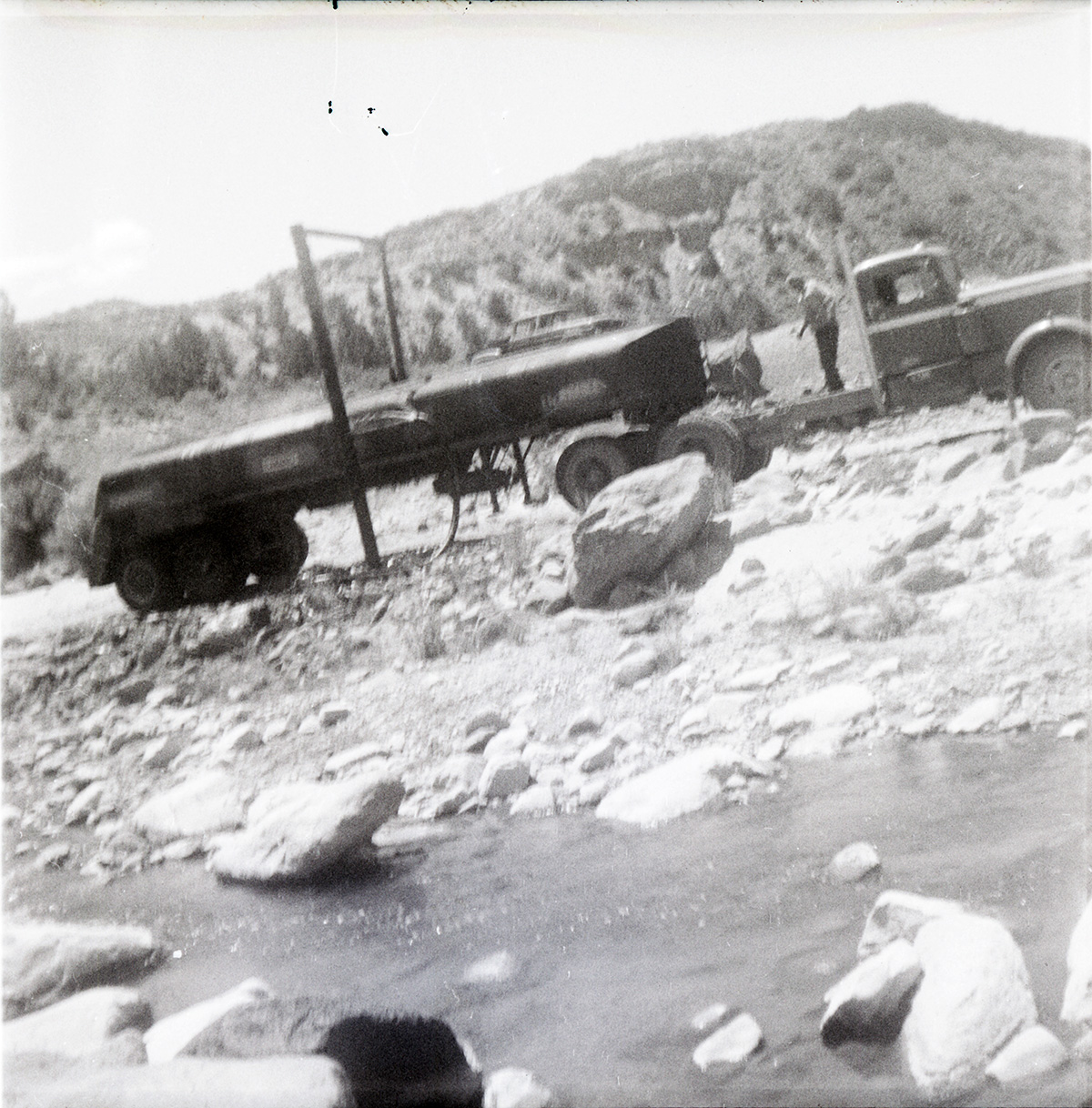 Construction vehicle in rocky area during chipsealing of Kolob Canyon Road.