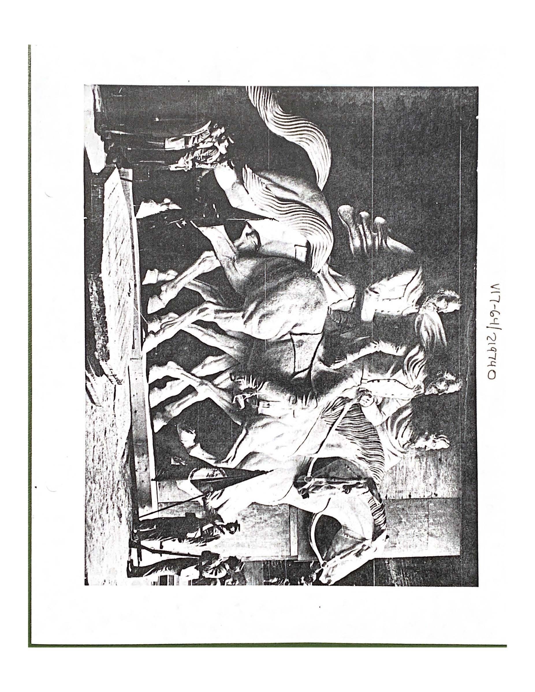 A statue of three men on horseback. 