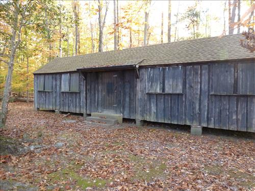 Paint/Stain Historic Structures in Cabin Camp 4