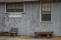 close-up view of post office and old cart
