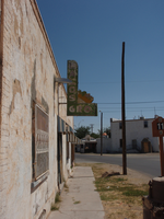 A brick building with a sign on it.