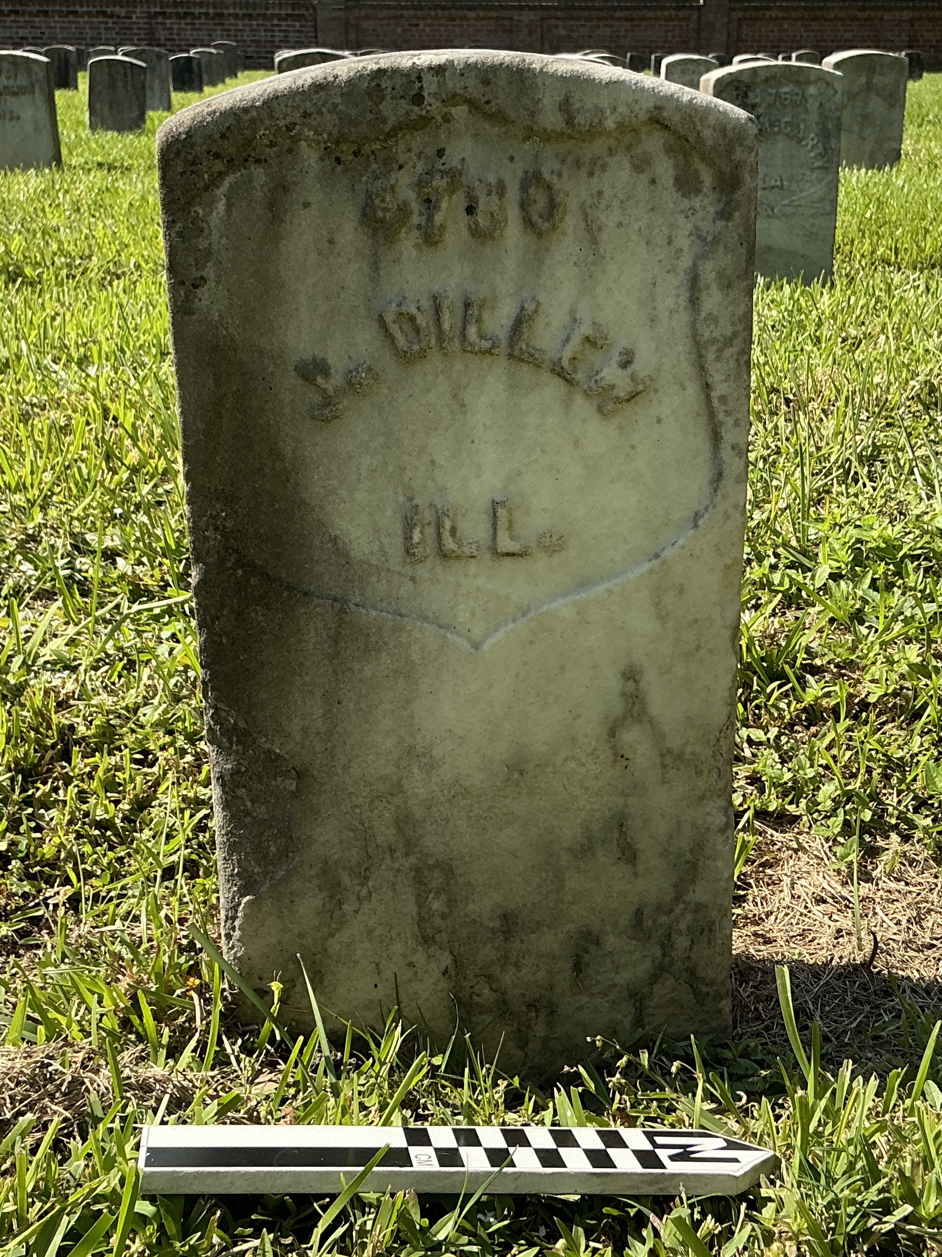Extra image of historic upright marble headstone with recessed shield face.