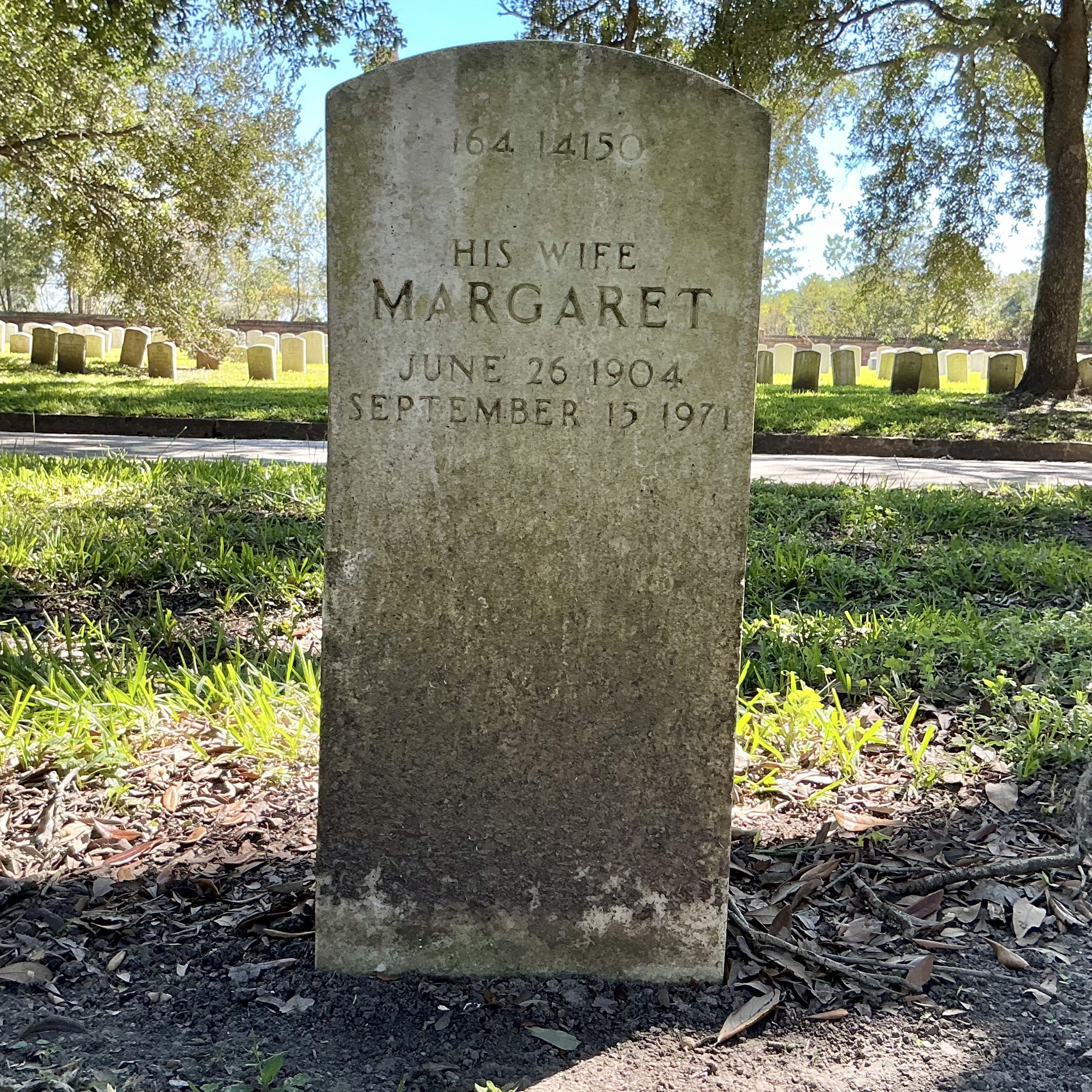 Back of upright marble headstone with flat face.