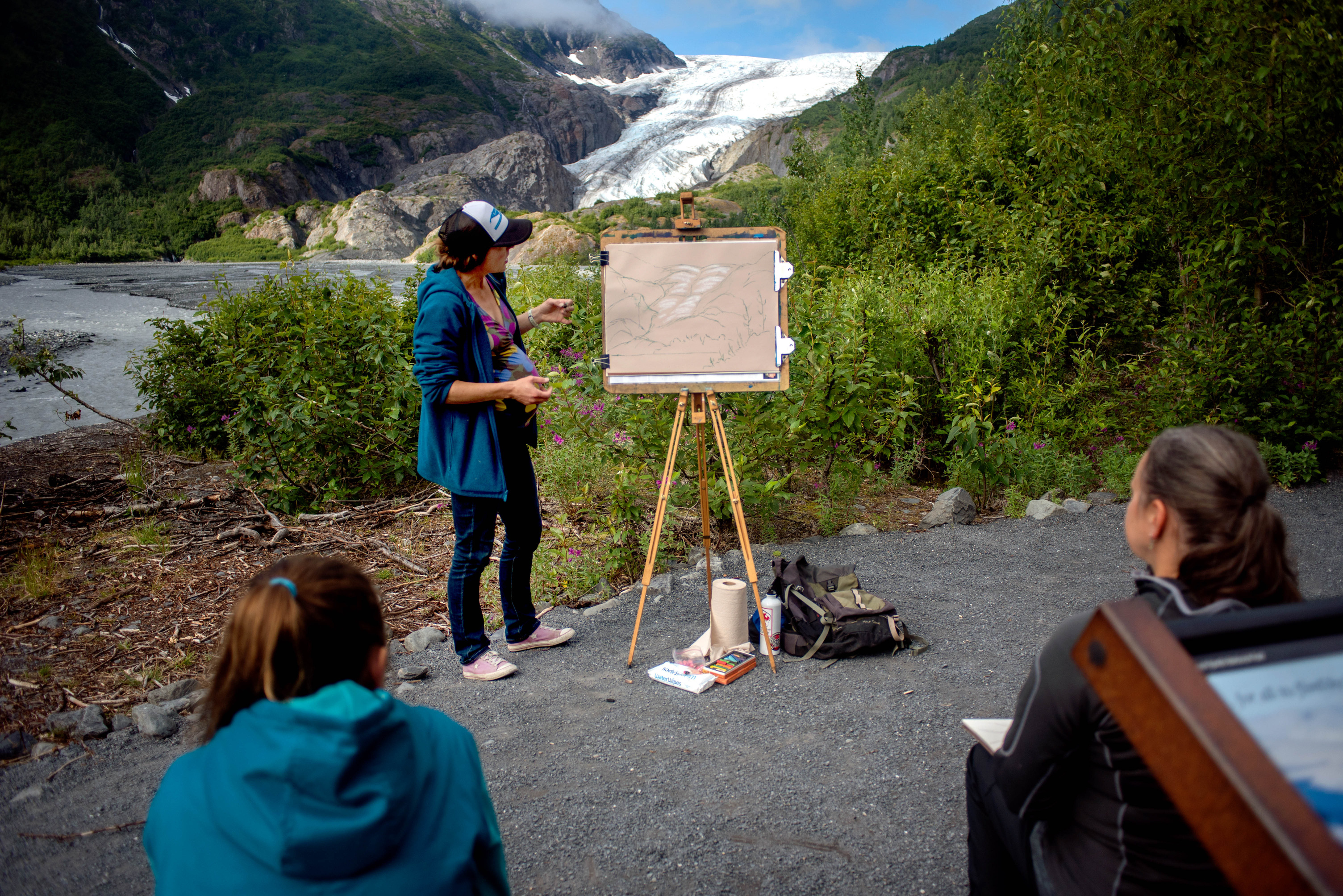 Artist in the Park, Justine Petchuzal, demonstrates how to roughs-in a sketch of Exit Glacier