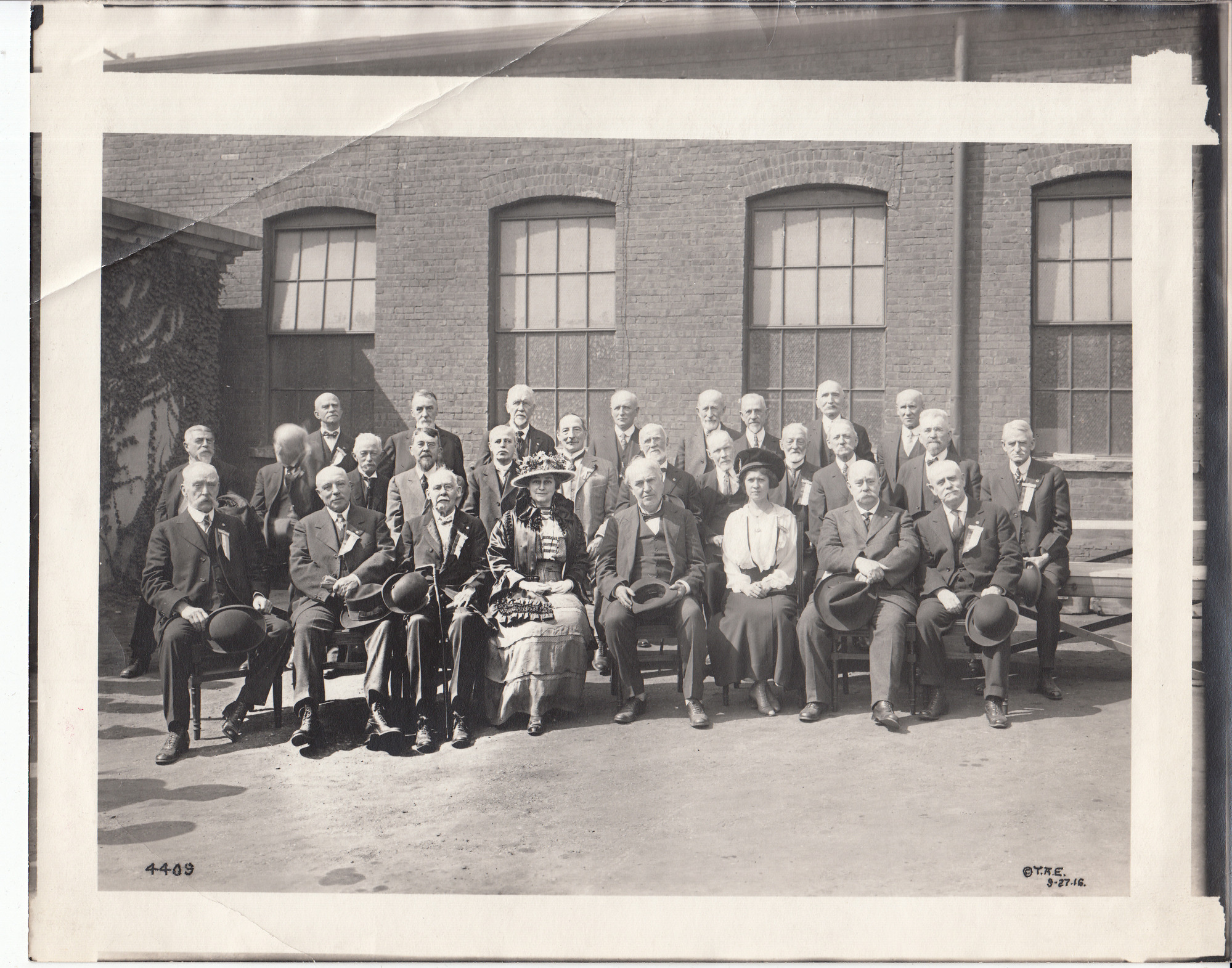 Thomas Edison, hat in hand, with old time telegraphers. Mina Edison at Edison's left.
