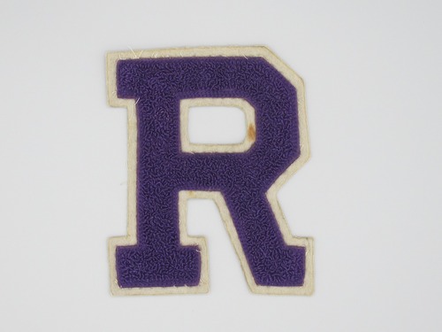 Varsity letter "R" in purple with white trim. Presented to Robert Earle Goding (KIA 03/03/1969) by a man who played against him in basketball during high school, "#14".