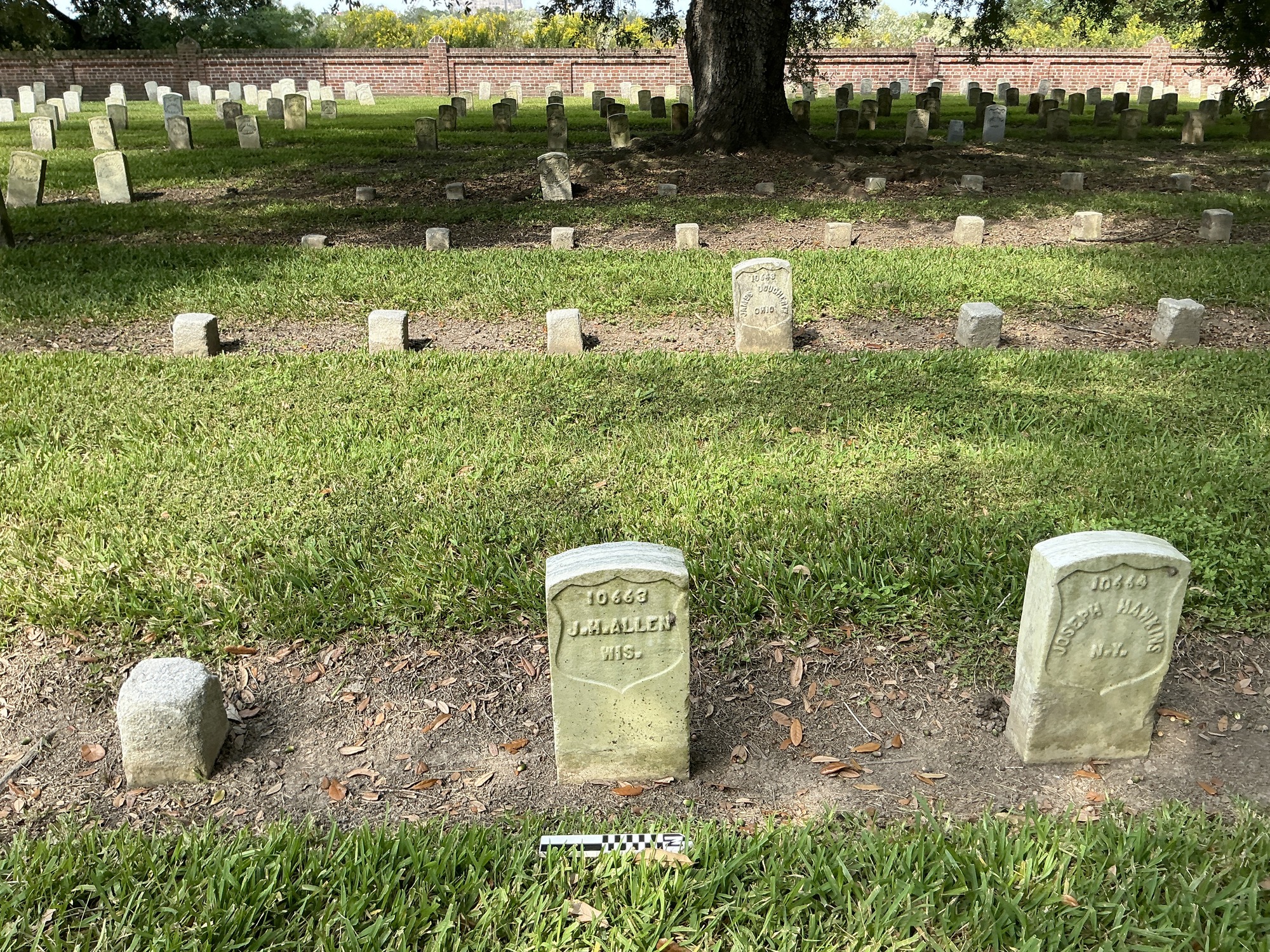Extra image of historic upright marble headstone with recessed shield face.