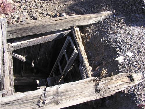 Open shafts and adits at Bighorn Mine, an abandoned gold mine in Feb 2007 and Jan 2009.