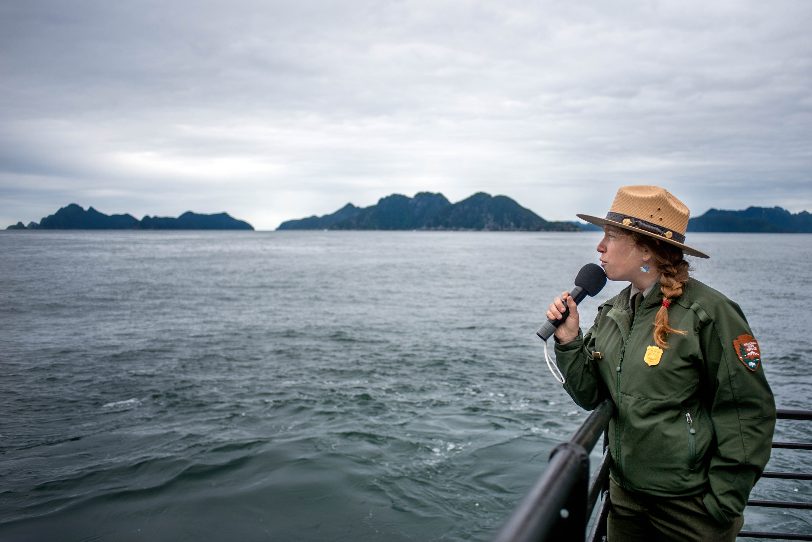 Interpretation Ranger Gillian Braver pointing out park features in Aialik Bay