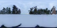 Spherical image of a granite monolith on a plaza covered in snow with Washington Monument in the distance across a river