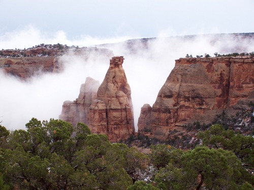 Misty monoliths in Monument Valley.