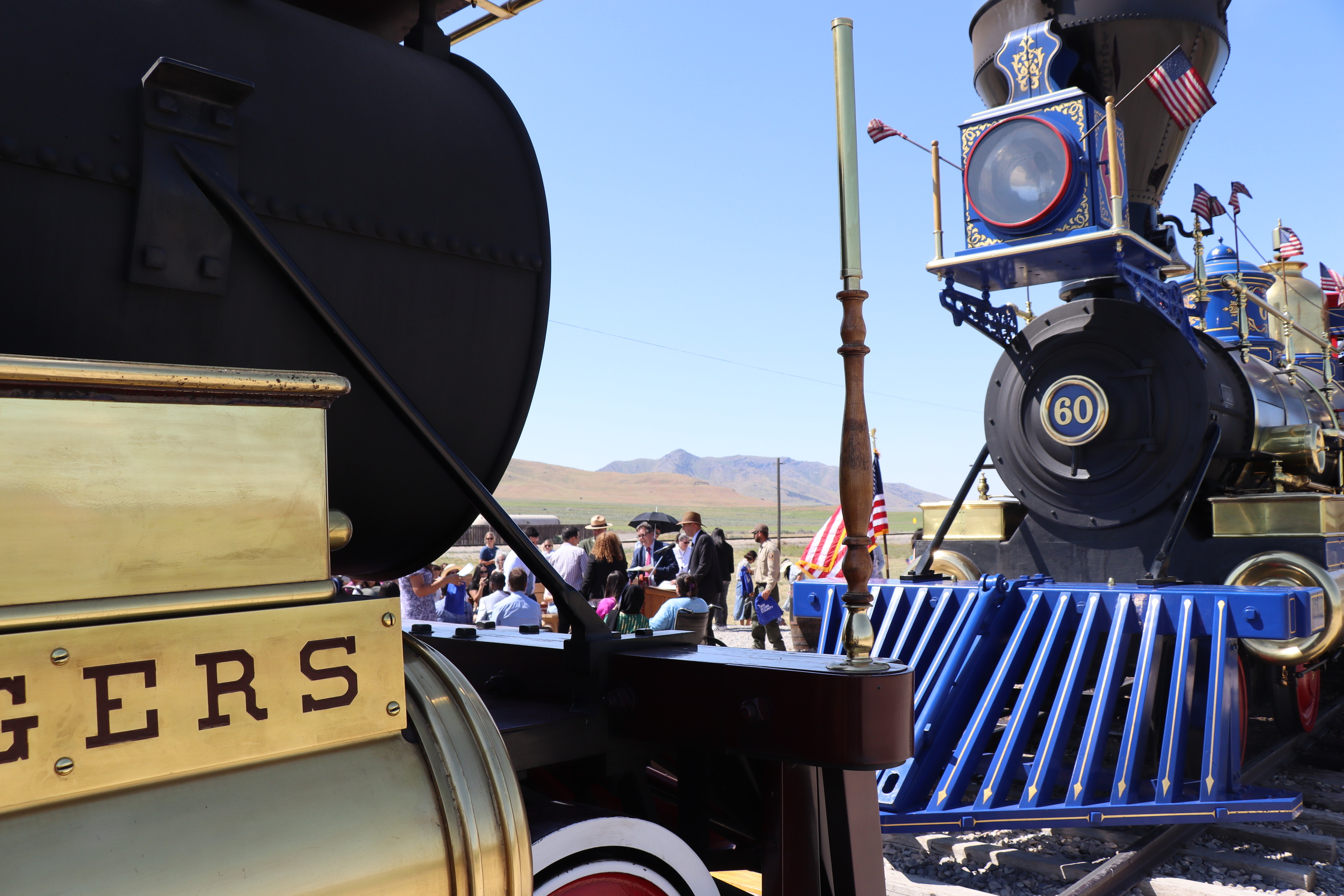 the Jupiter and No. 119 face each other as new citizens receive their certificates in the background
