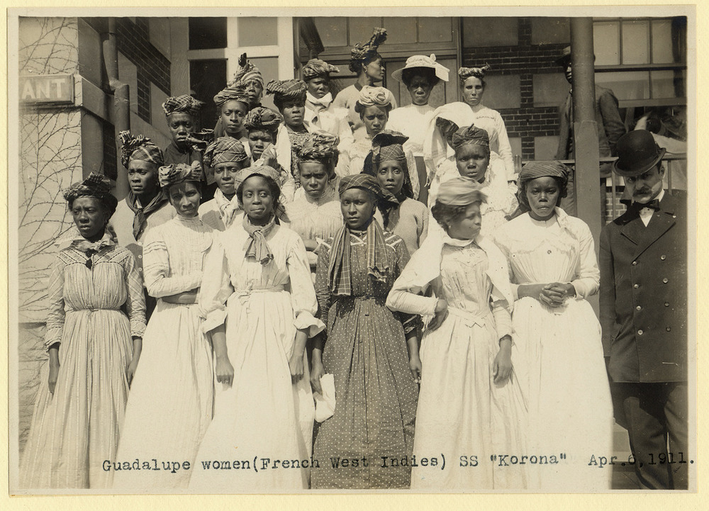 Group of women posing outside Ellis Island