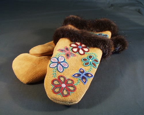 Pair of moosehide gauntlets trimmed with beaver and adorned with floral beadwork 
