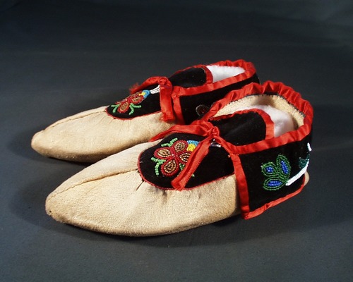 Beaded moccasins with red trim