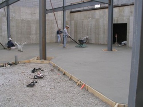 Finishing the concrete floor of the Heritage Center