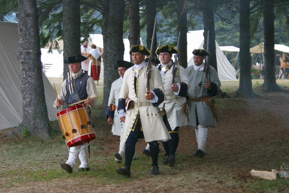 French military re-enactors march from the Historic Encampment to their presentation inside the stockade grounds, Rendezvous Days 2007.