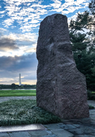 Lyndon Baines Johnson Memorial Grove on the Potomac. Granite monolith on a plaza with Washington Monument in the distance across a river