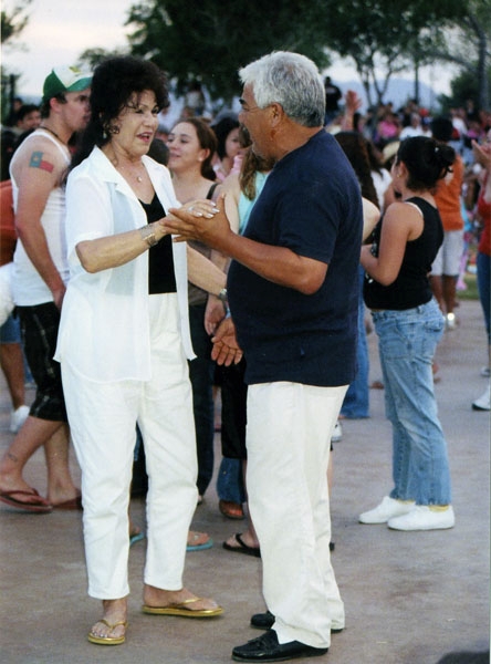 A couple enjoys a dance during the outdoor concert.