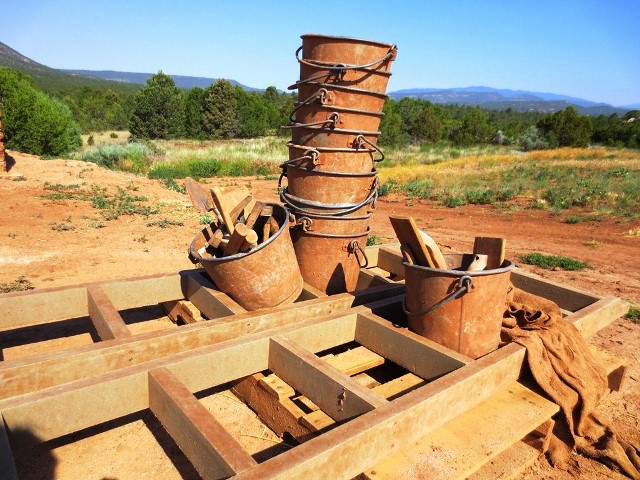 Brown buckets and wooden trowels