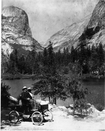 The first motor vehicle to enter Yosemite Valley. Oliver Lippincott & Edward E. Russell in a Locomobile at Mirror Lake. Original in the Los Angeles County Museum of Natural History.