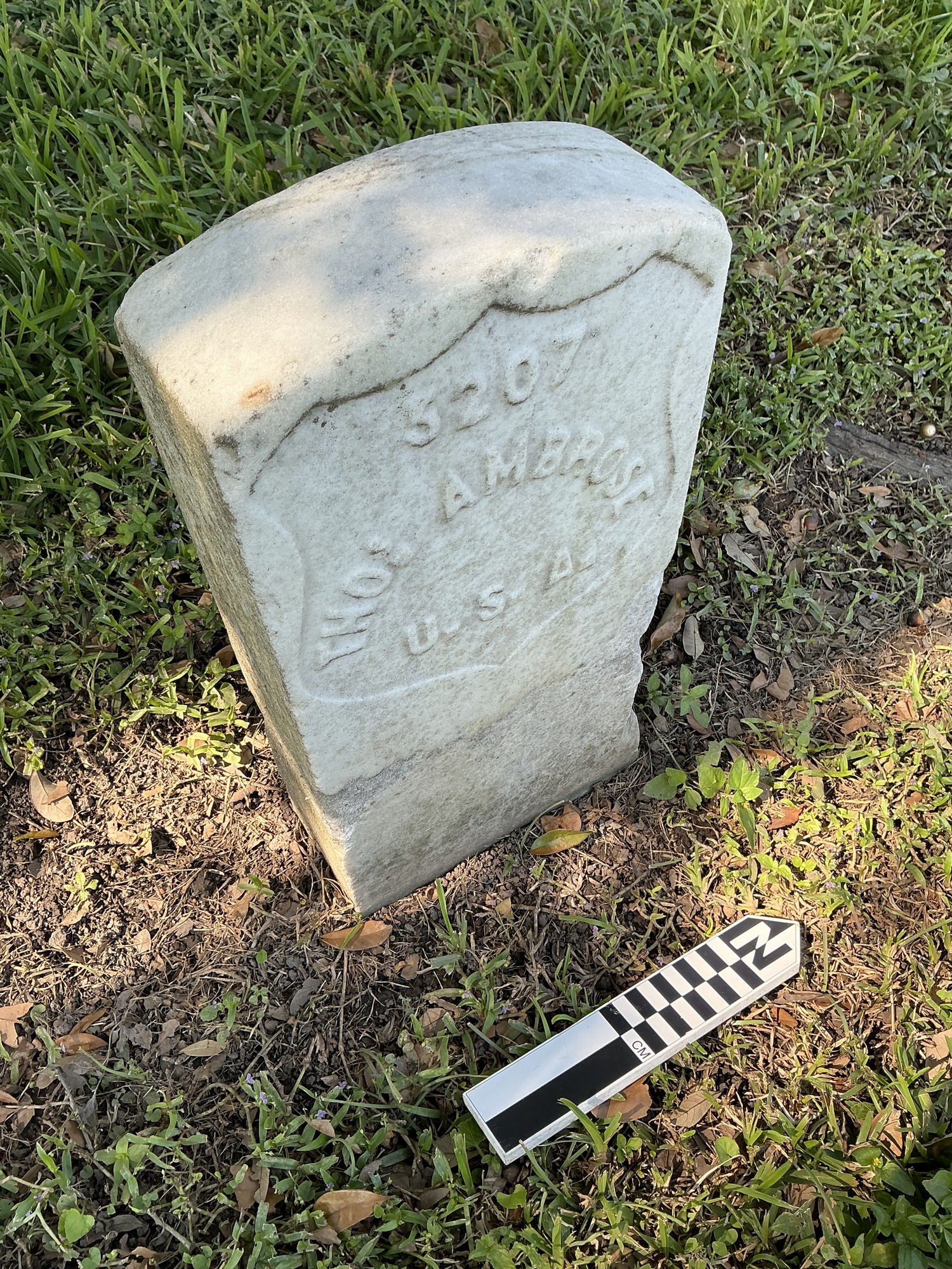 Extra image of historic upright marble headstone with recessed shield face.