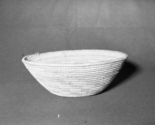 Mrs. Donald Segerstrom Collection. Object: Papago basket. Dimensions: 18 1/2 x 6 1/2". Materials: yucca, two ply twisted sinew, cordage. Technology: ---. Collection History: ---. Photographed by Michael Dixon, 1/83. Catalogued by Craig Bates and Barbara Beroza. Yosemite Collections, National Park Service.