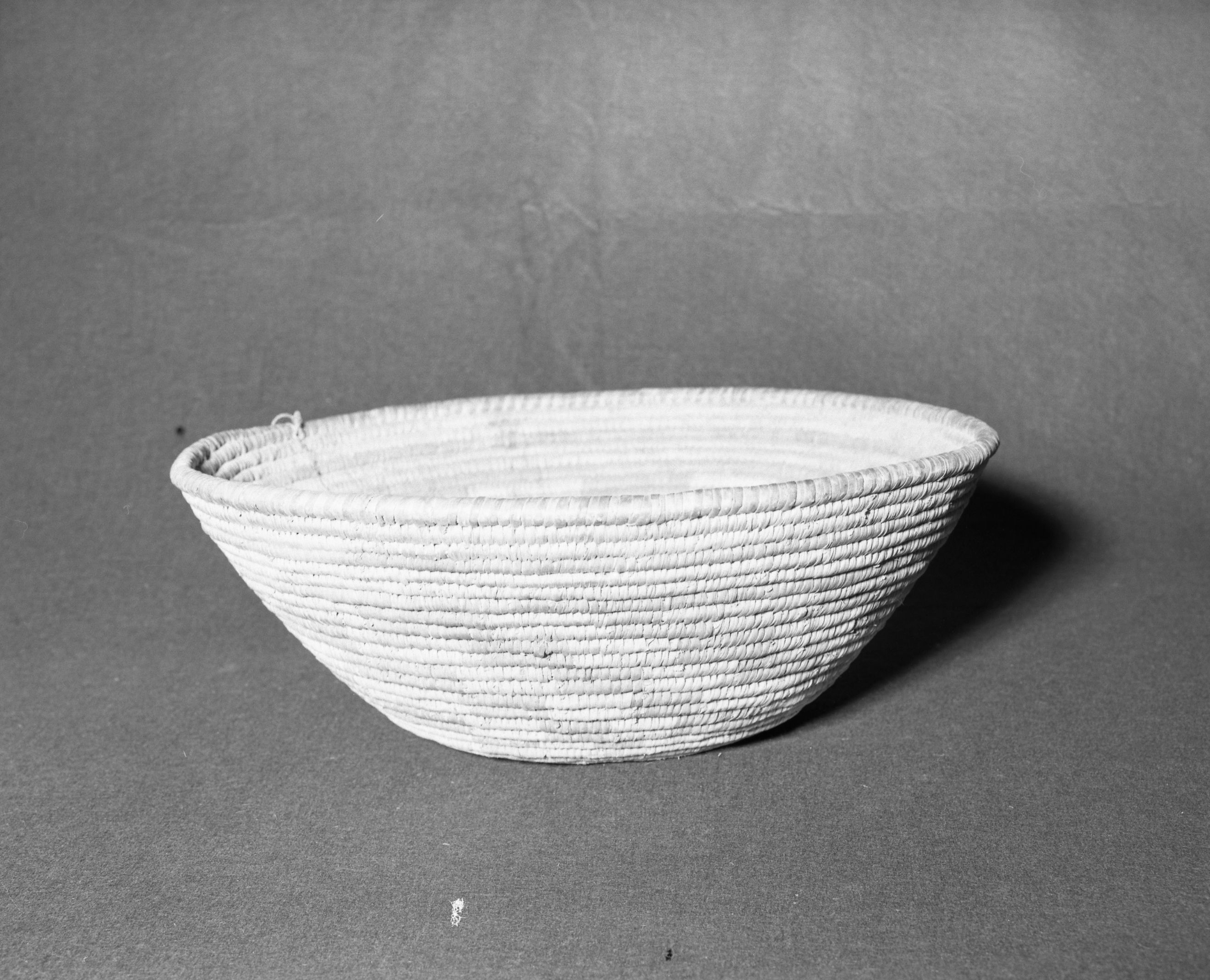 Mrs. Donald Segerstrom Collection. Object: Papago basket. Dimensions: 18 1/2 x 6 1/2". Materials: yucca, two ply twisted sinew, cordage. Technology: ---. Collection History: ---. Photographed by Michael Dixon, 1/83. Catalogued by Craig Bates and Barbara Beroza. Yosemite Collections, National Park Service.