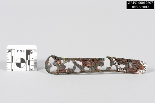 Cast brass cartouche knife handle fragment.