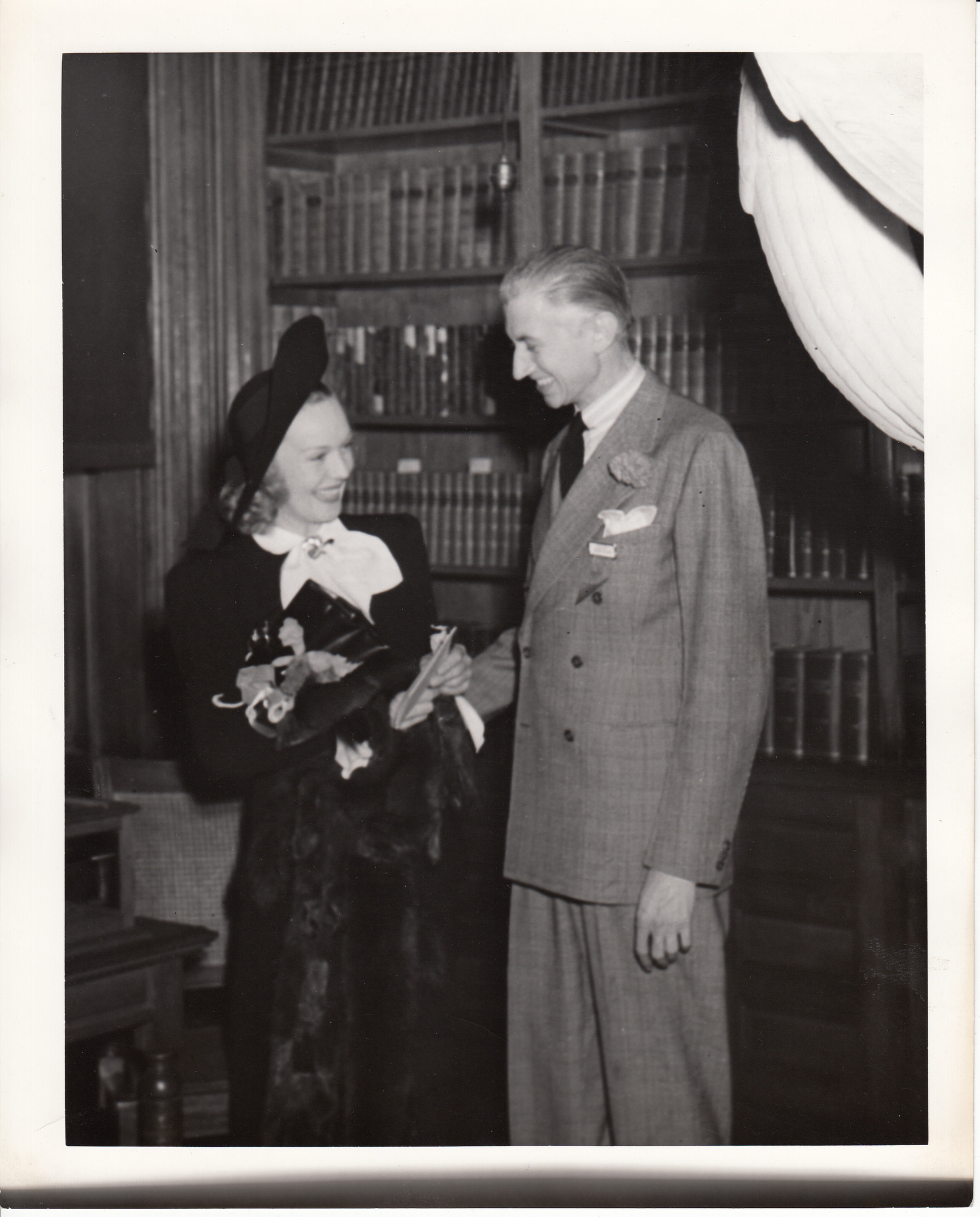 Rita Johnson and unidentified man in Building 5 library.
