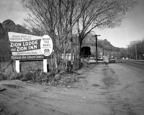 Roadside signs in Springdale, Utah Parks Company - Zion Lodge and Inn.
