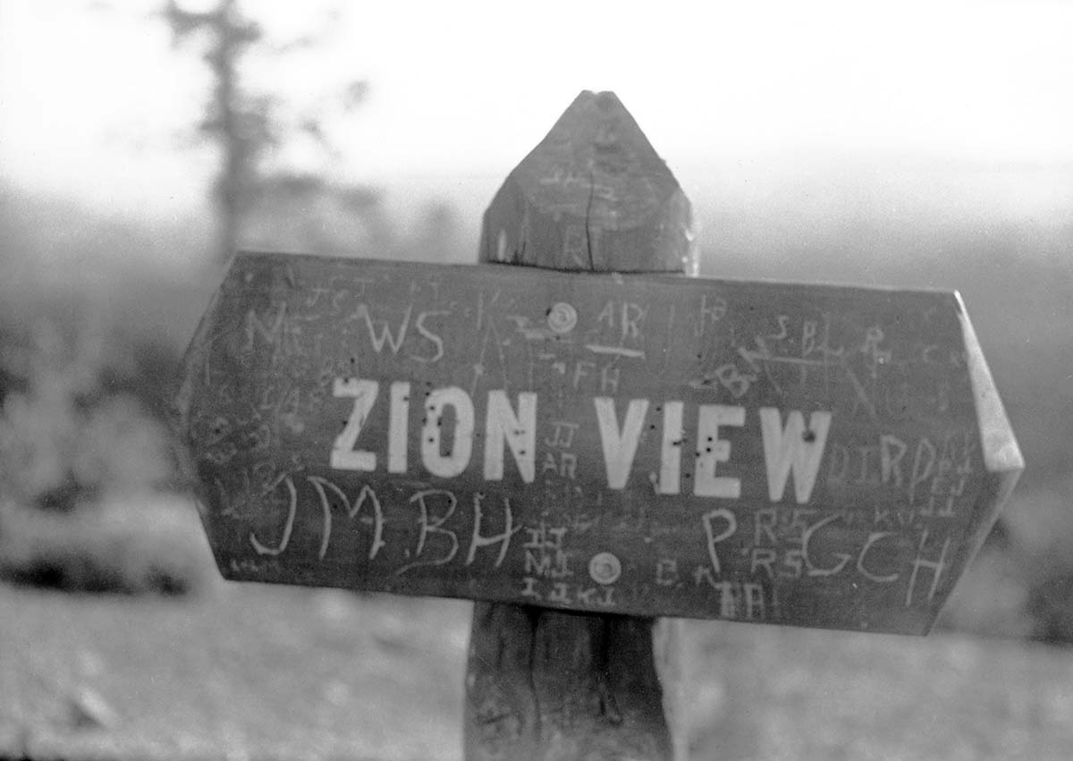 Vandalized sign 'Zion View.'