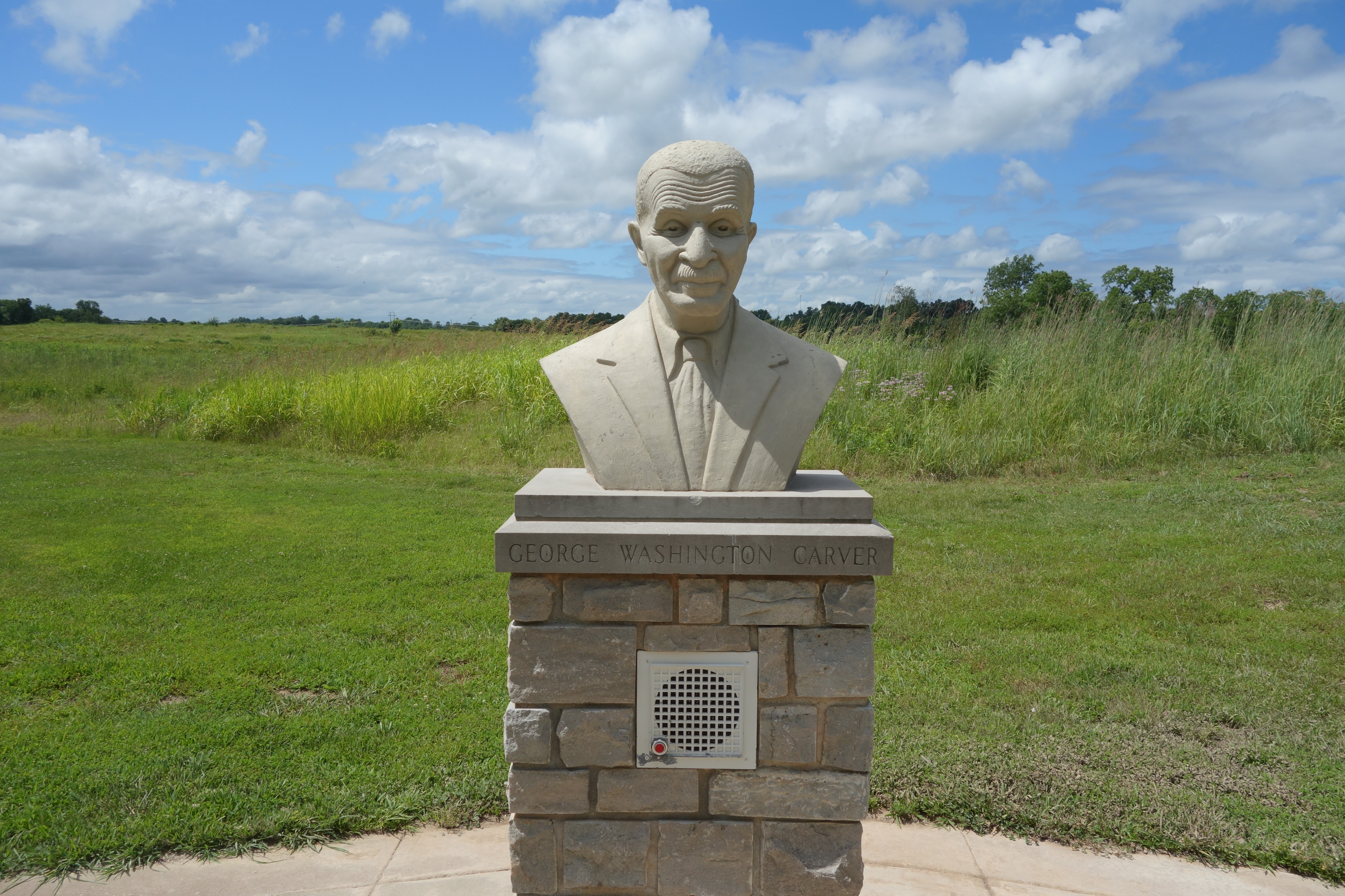 A bust of George Washington Carver of a pestal. 