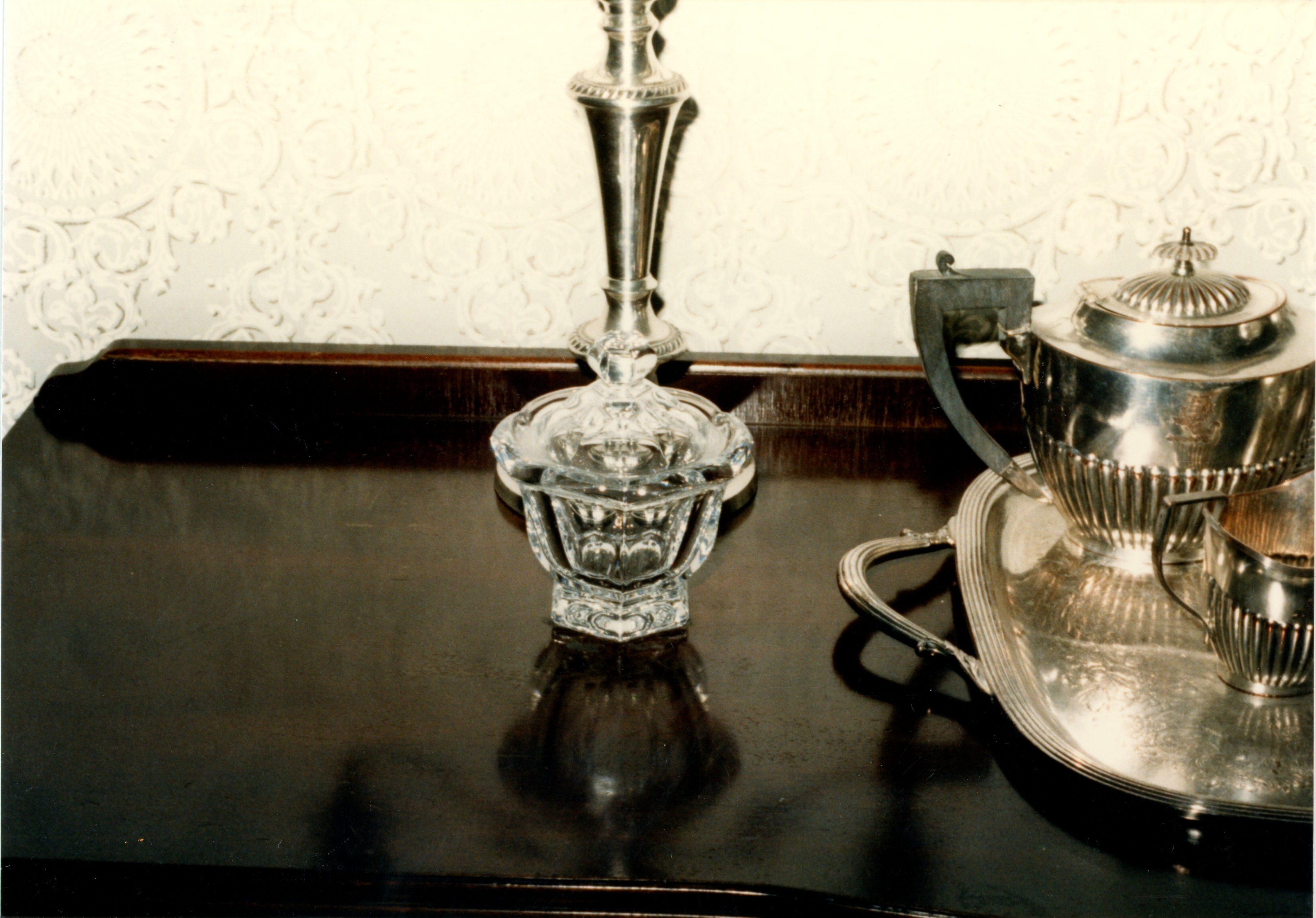 Glass dish on west end of sideboard in dining room