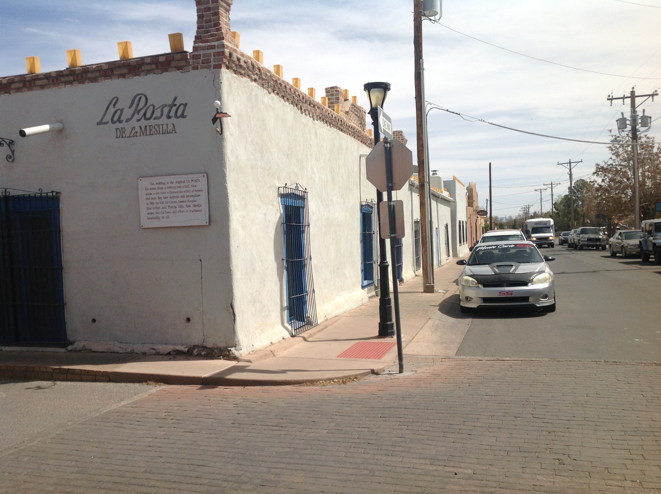 A white building with blue shutters.