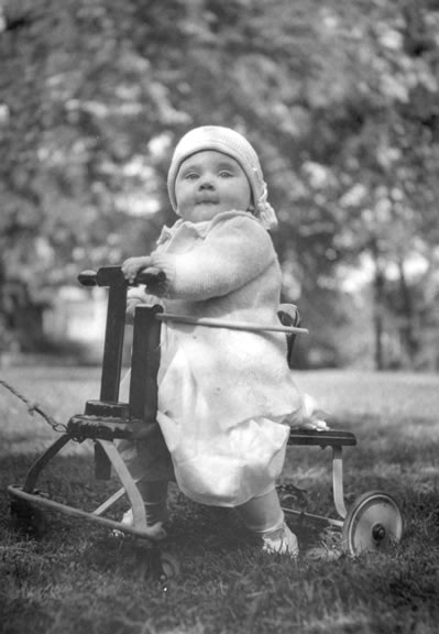 Margaret Truman being pulled on toy in the yard of the Truman Home, 1924-25. Harry S. Truman Library, # 82-352-1.