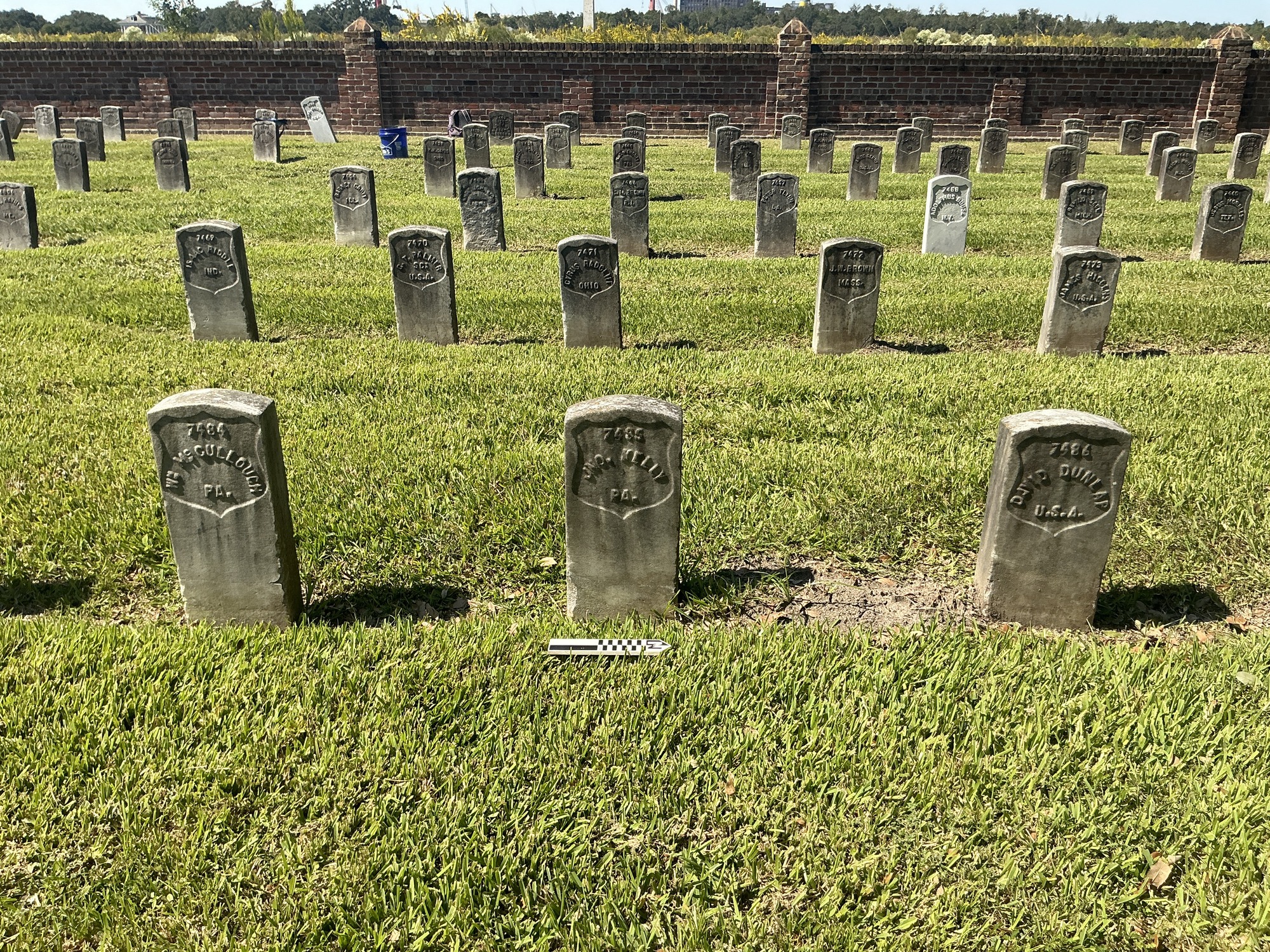 Extra image of historic upright marble headstone with recessed shield face.
