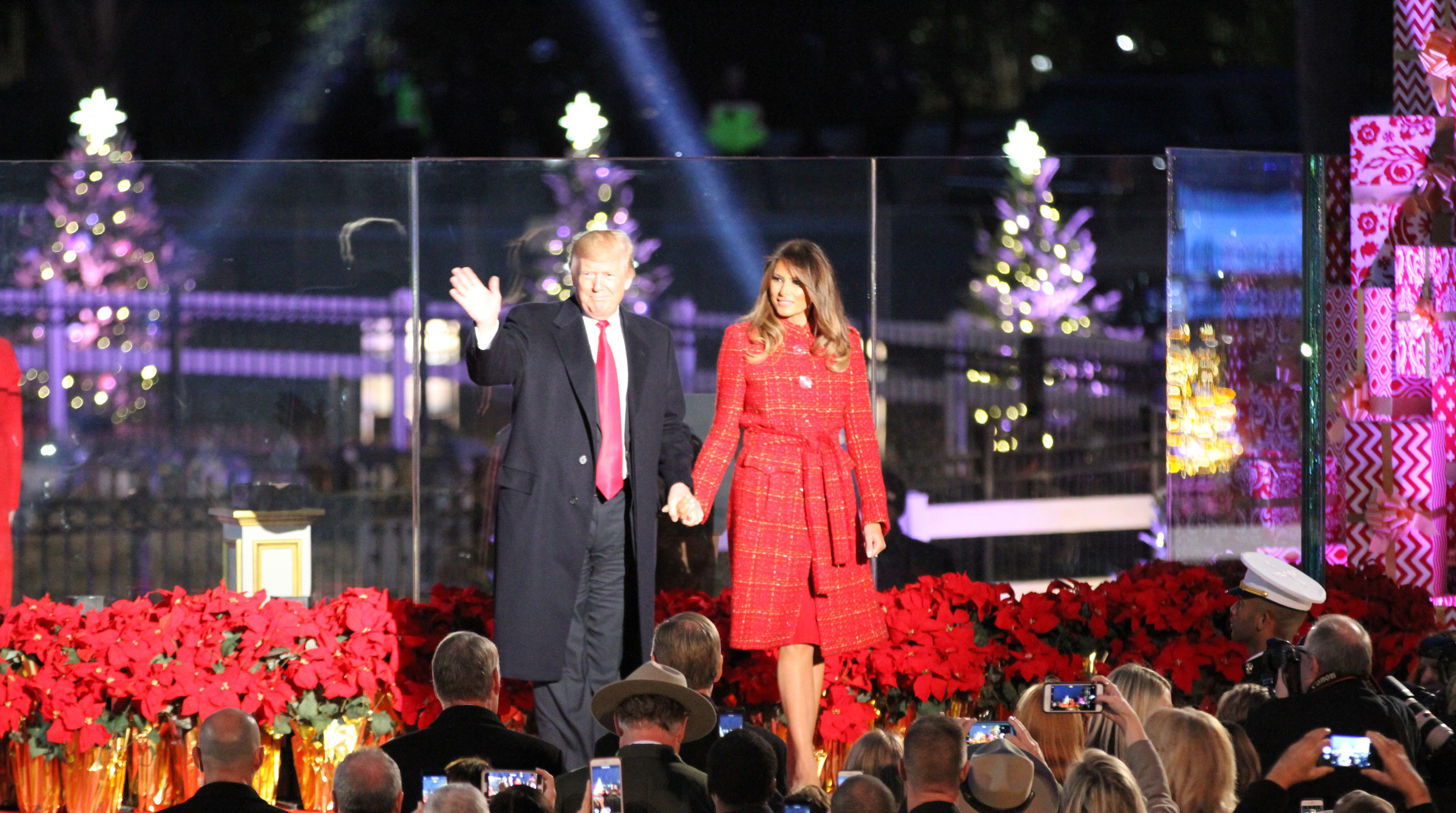President Donald Trump and First Lady Melania Trump wave to the crowd at the 2017 National Christmas Tree Lighting. 