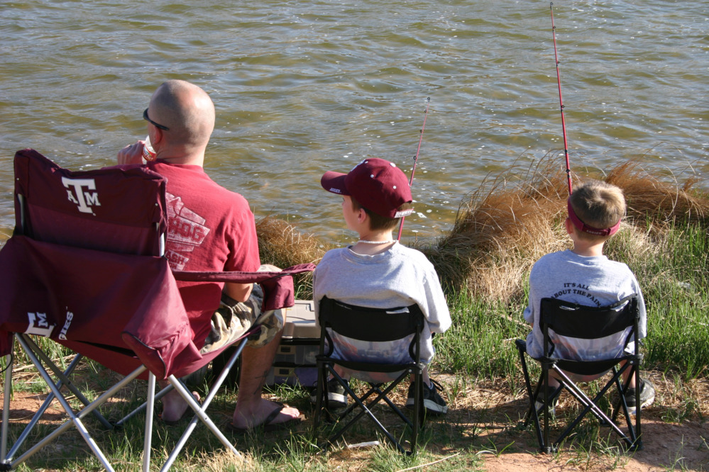 Family fishing at the lake.