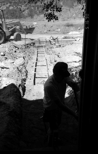 Man working during the construction of headquarters addition.