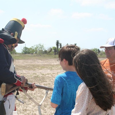 A Soldado gives a musket talk to visitors