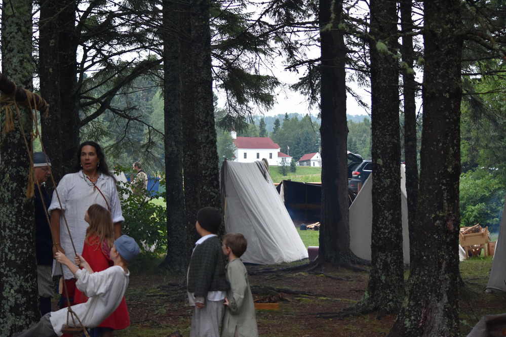 Kids enjoying a swing in the Pines