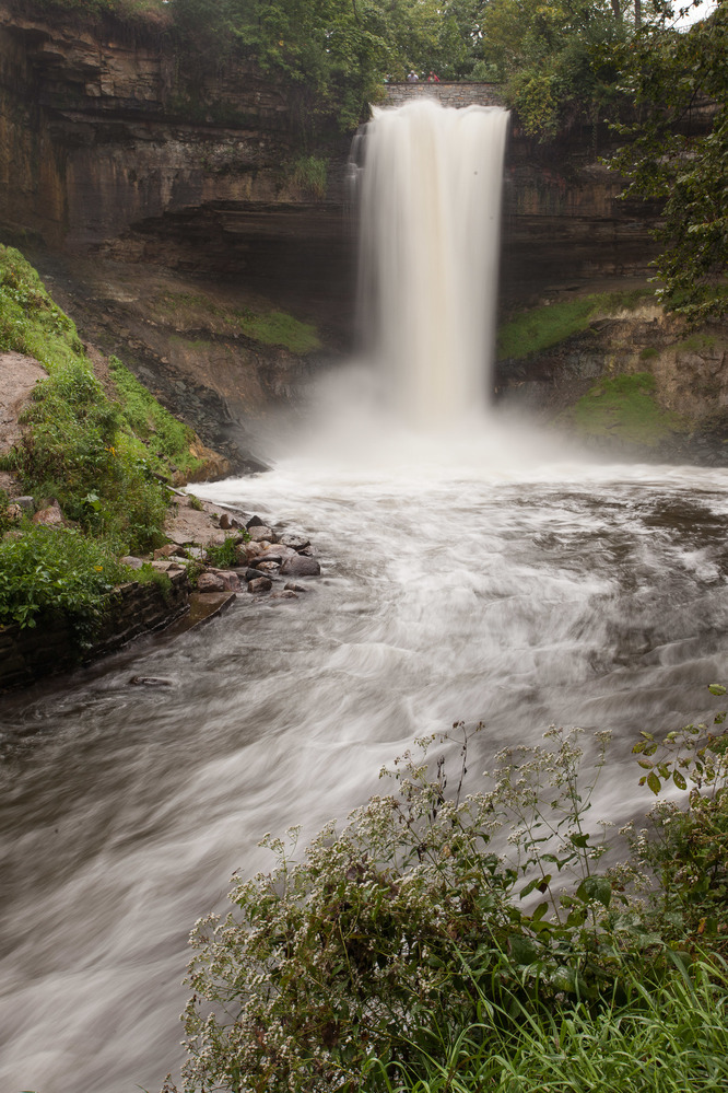 A waterfall tumbles into a gorge.