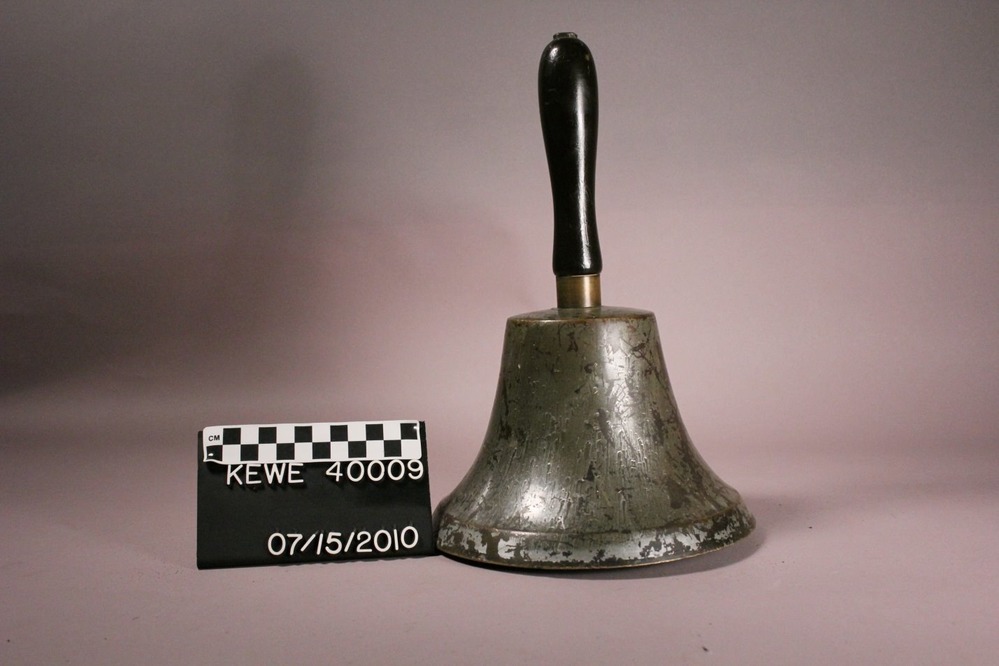 A heavy cast brass bell reclaimed from the ruins of the Washington School fire, on display today at the Calumet Visitor Center.