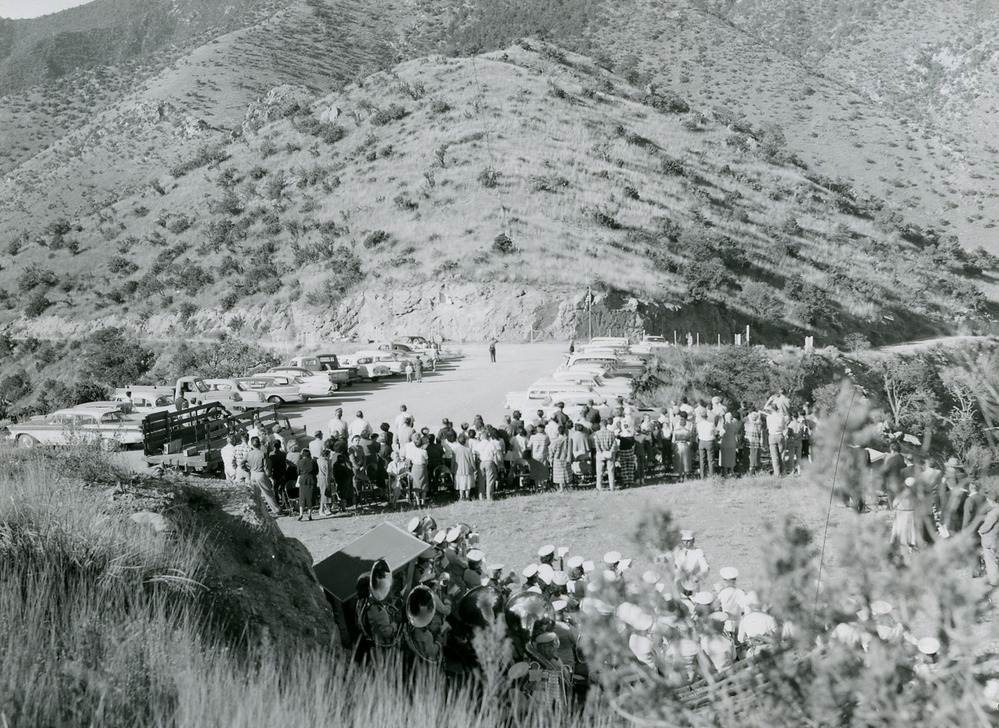 Large crowd gathering for event in the mountains