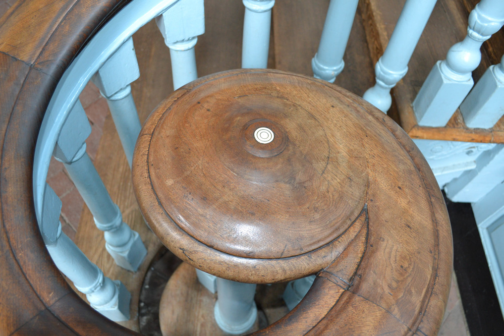 Detail showing volute with inlaid ivory button on staircase inside Independence Hall.