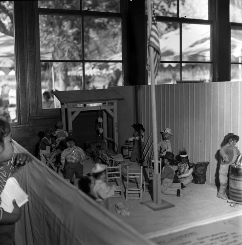 Child looks at a western diorama depicting life in the 'old days' at the second annual Folklife Festival, inside the Zion National Park Nature Center, September 7-8, 1978.