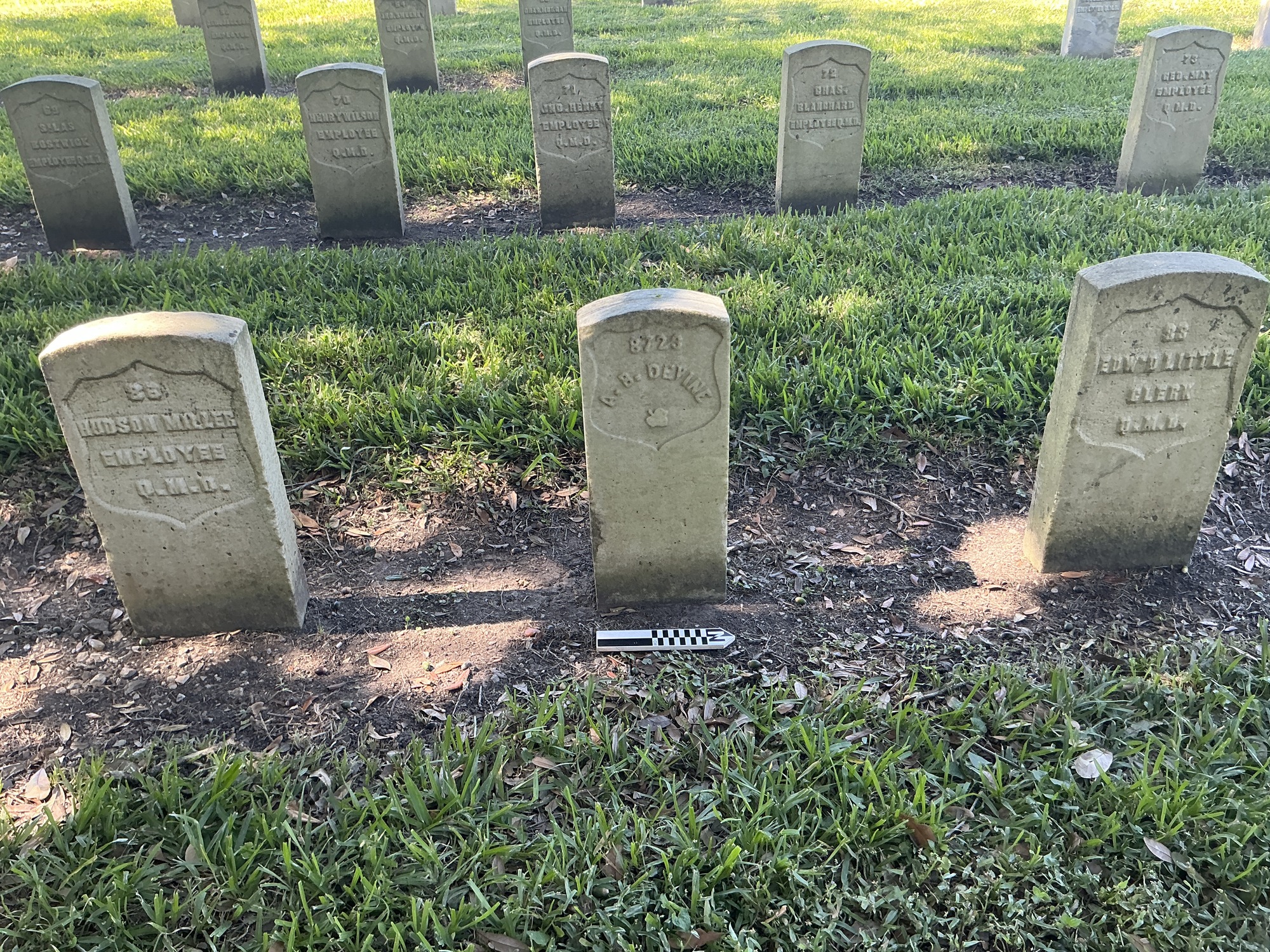Extra image of historic upright marble headstone with recessed shield face.