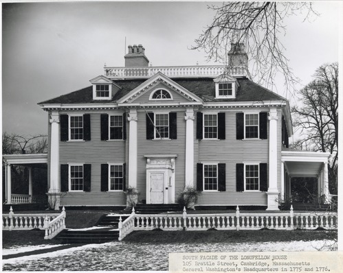 Black and white photograph of large mansion with symmetrical facade, two and a half stories, with porches at sides and low railing along front. Typed label on corner.